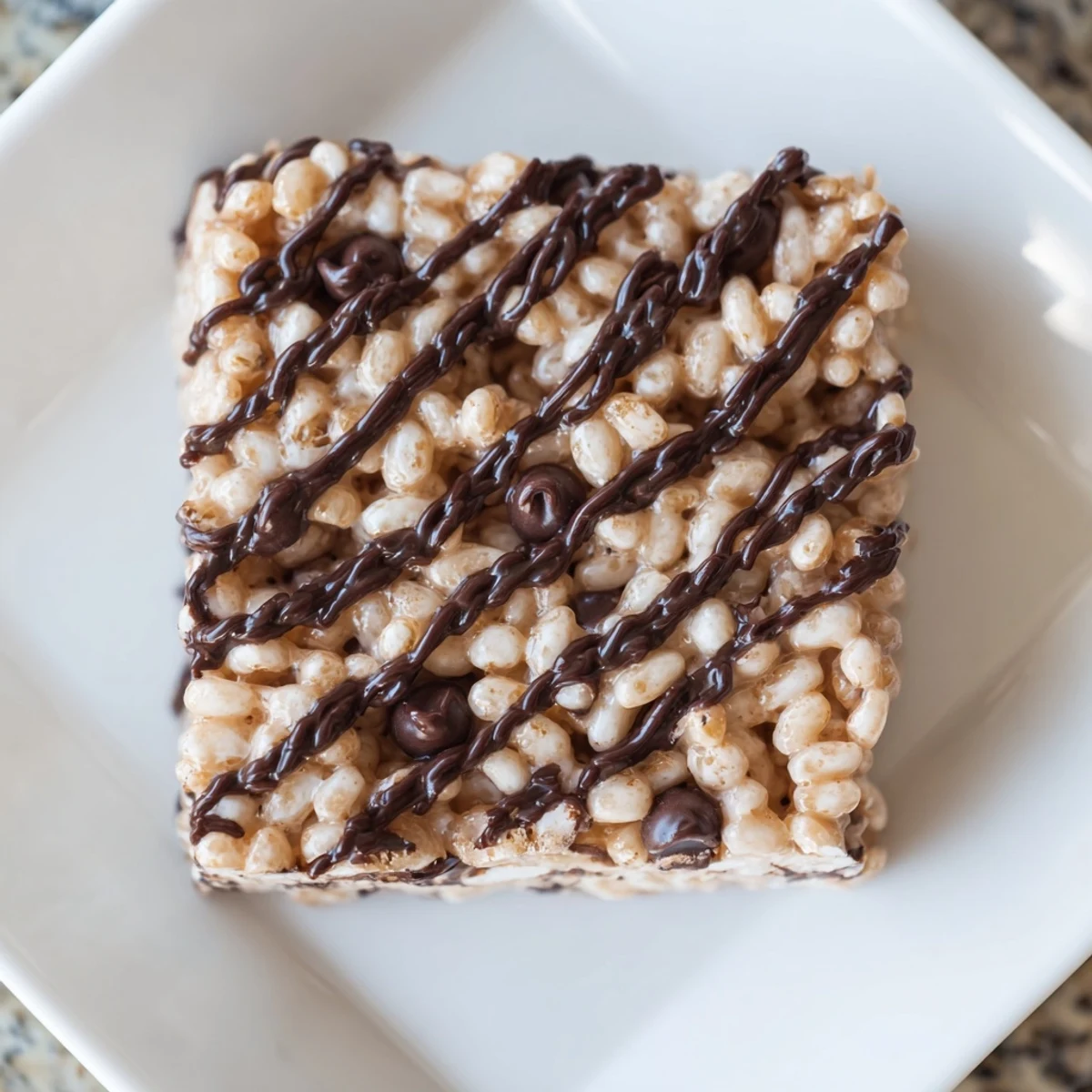Homemade Rice Krispie Treats, studded throughout with crispy rice cereal and gooey melted marshmallows.