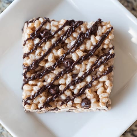 Homemade Rice Krispie Treats, studded throughout with crispy rice cereal and gooey melted marshmallows.