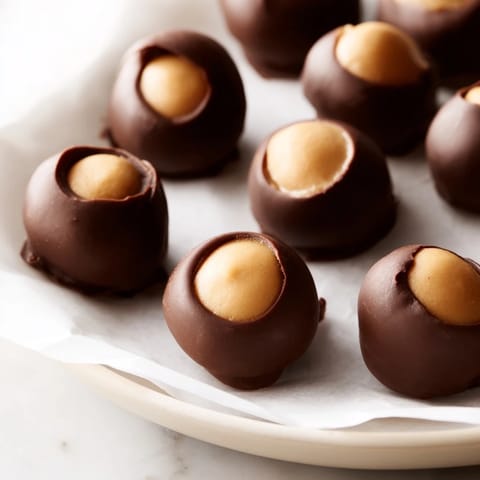 These homemade buckeyes feature perfect creamy centers, ready to enjoy as a sweet treat this holiday.