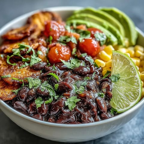 Vibrant Plant-Based Taco Bowl brimming with seasoned black beans and fresh salsa.