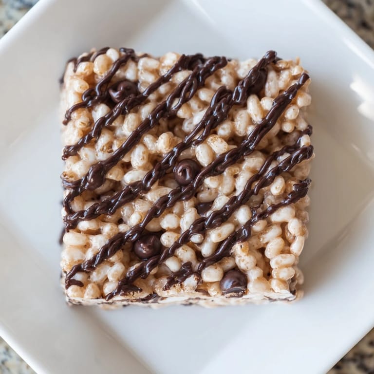 Homemade Rice Krispie Treats, studded throughout with crispy rice cereal and gooey melted marshmallows.